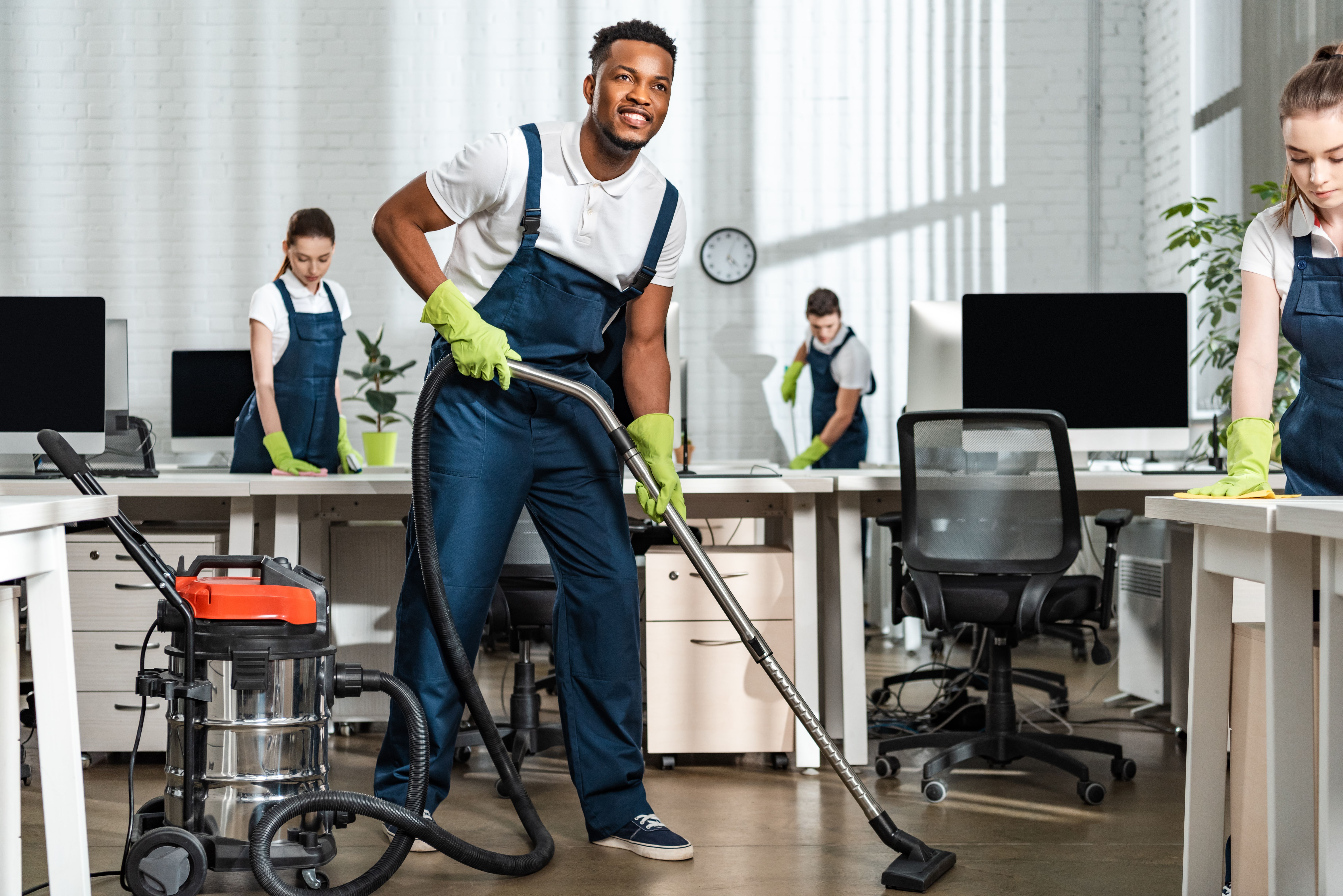 Team vacuuming office
